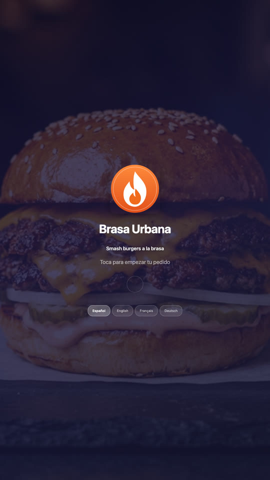 The kiosk's welcome screen: the Brasa Urbana logo over a photo of a burger, tap to start, and the languages.